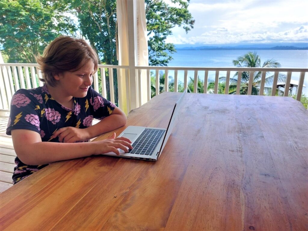 Little Man working on his laptop on our balcony in Panama.